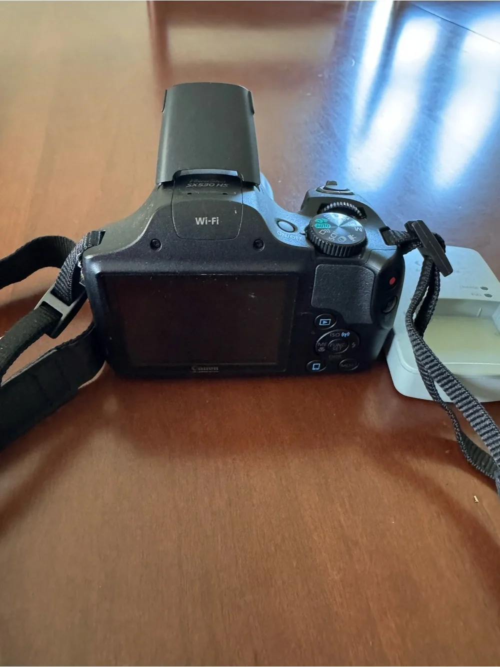 Canon Black Digital Bridge Camera with White Battery Charger